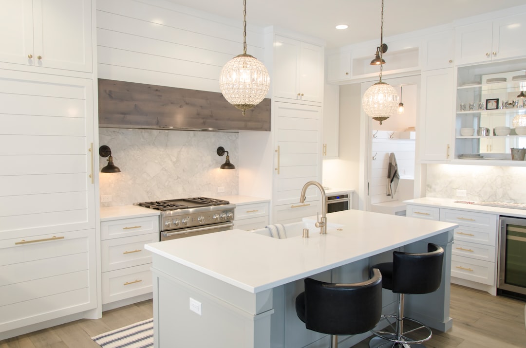 Renovated kitchen with cabinets, counters, and an island