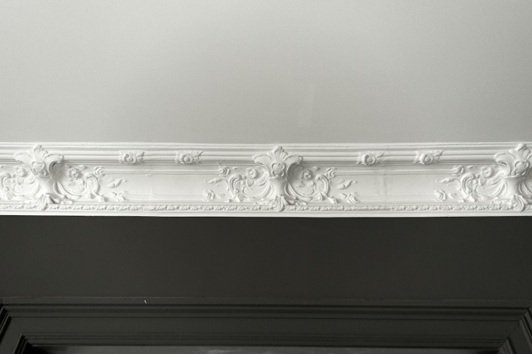Finished interior fireplace with decorative trim and molding